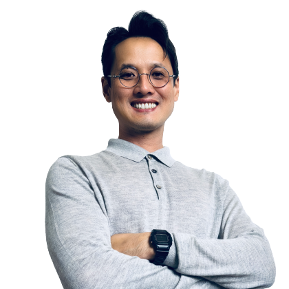 Linc, a foreign export marketing consultant based in Taiwan, standing in front of a world map